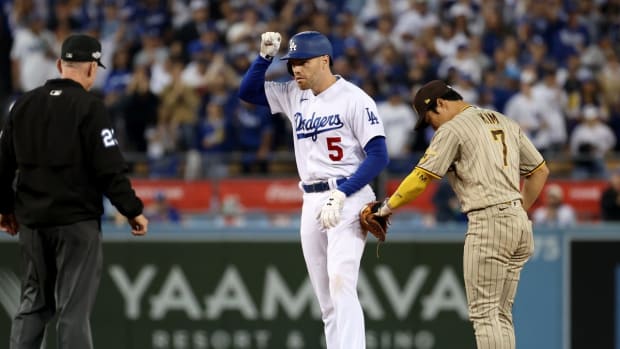 Oct 12, 2022; Los Angeles, California, USA; Los Angeles Dodgers first baseman Freddie Freeman (5) reacts after hitting a double in the ninth inning of game two of the NLDS for the 2022 MLB Playoffs against the San Diego Padres at Dodger Stadium. Mandatory Credit: Kiyoshi Mio-USA TODAY Sports